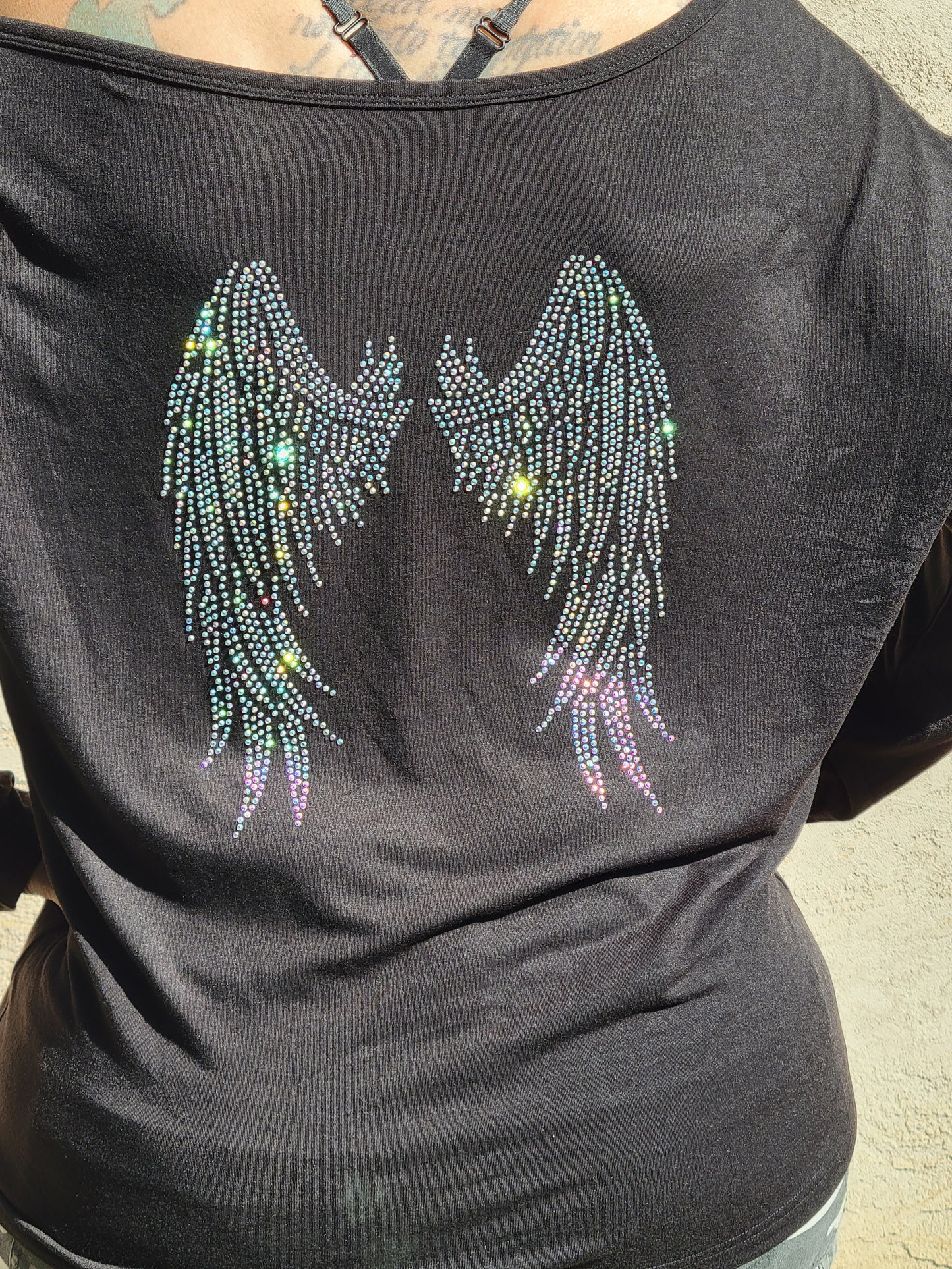 Off the shoulder long sleeve Hope Dealer shirt with wings on the back