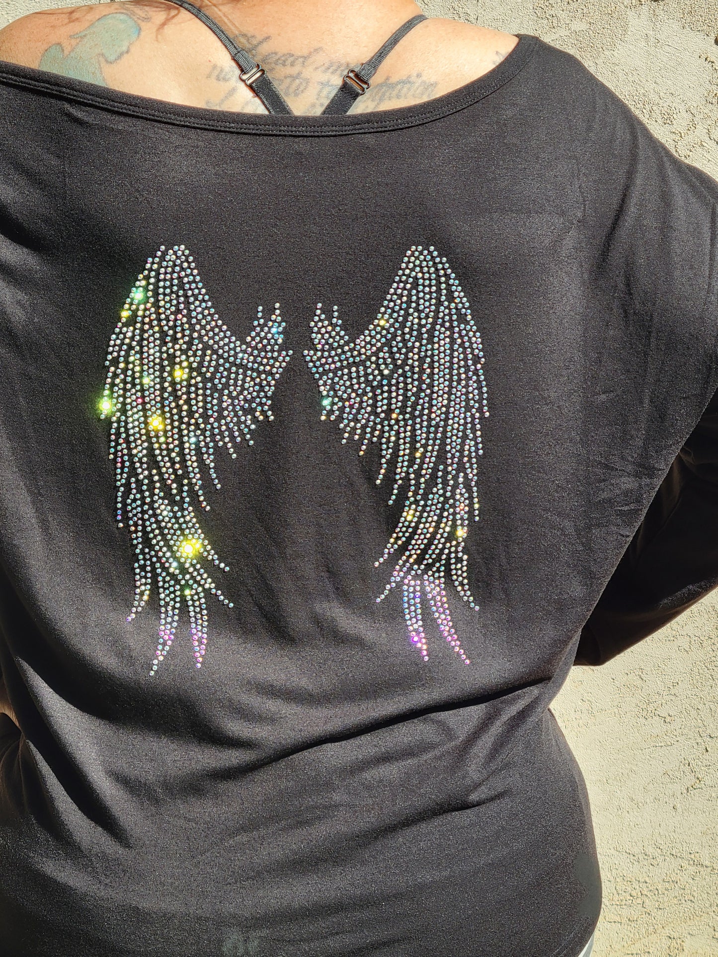 Off the shoulder long sleeve Hope Dealer shirt with wings on the back