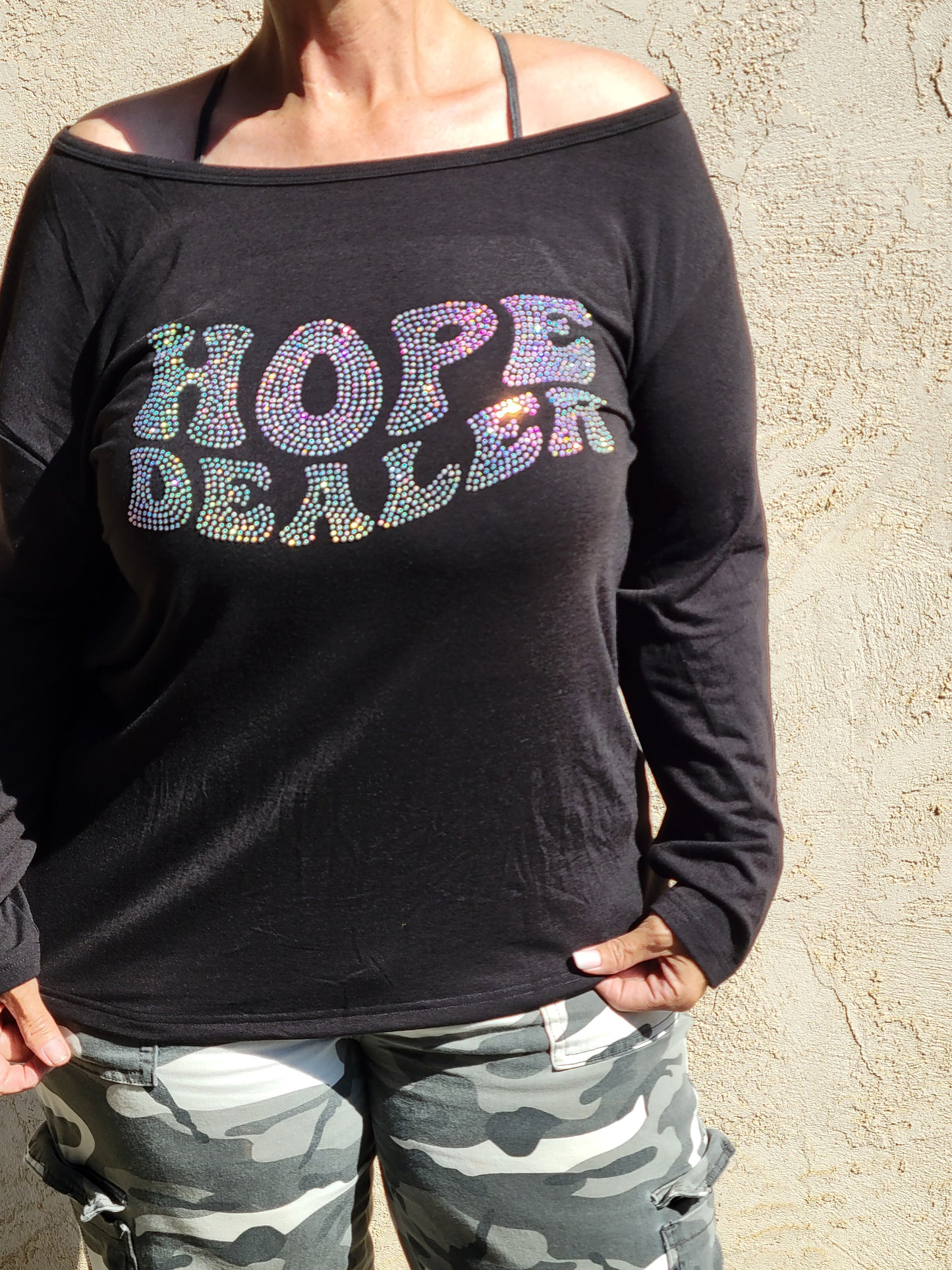 Off the shoulder long sleeve Hope Dealer shirt with wings on the back