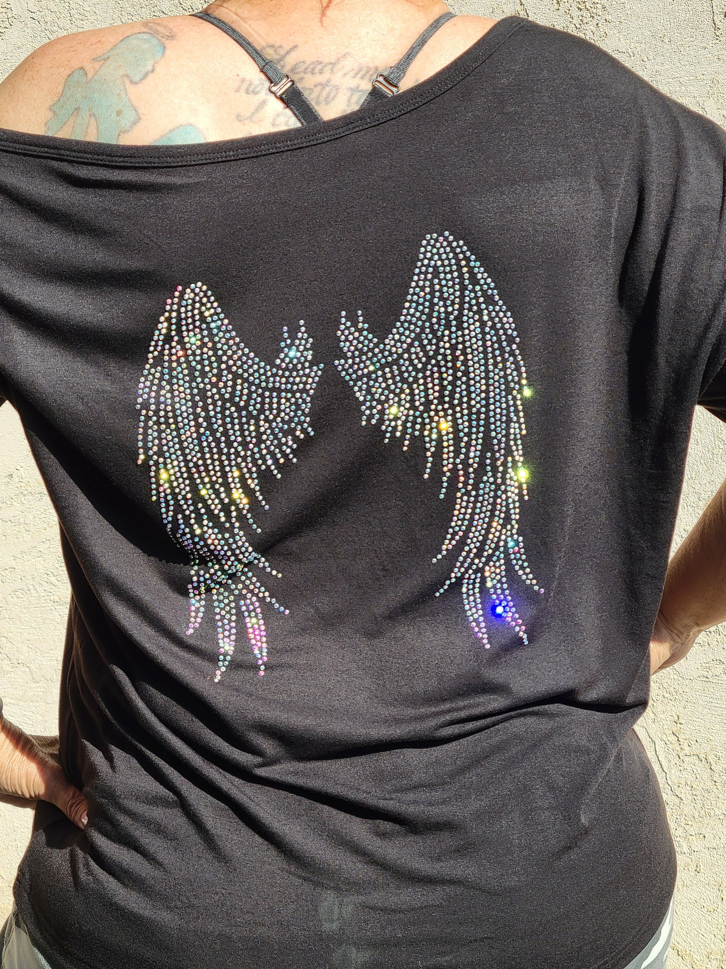 Off the shoulder long sleeve Hope Dealer shirt with wings on the back